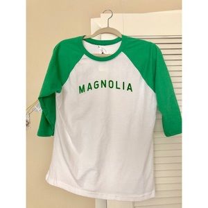 Magnolia baseball tee with kelly green accents.